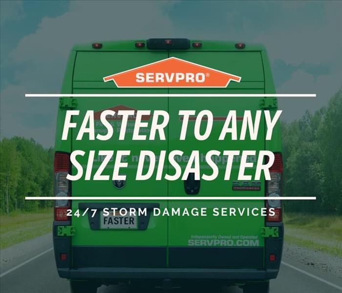 Image of the Back of the SERVPRO van with the caption Faster to any Size Disaster